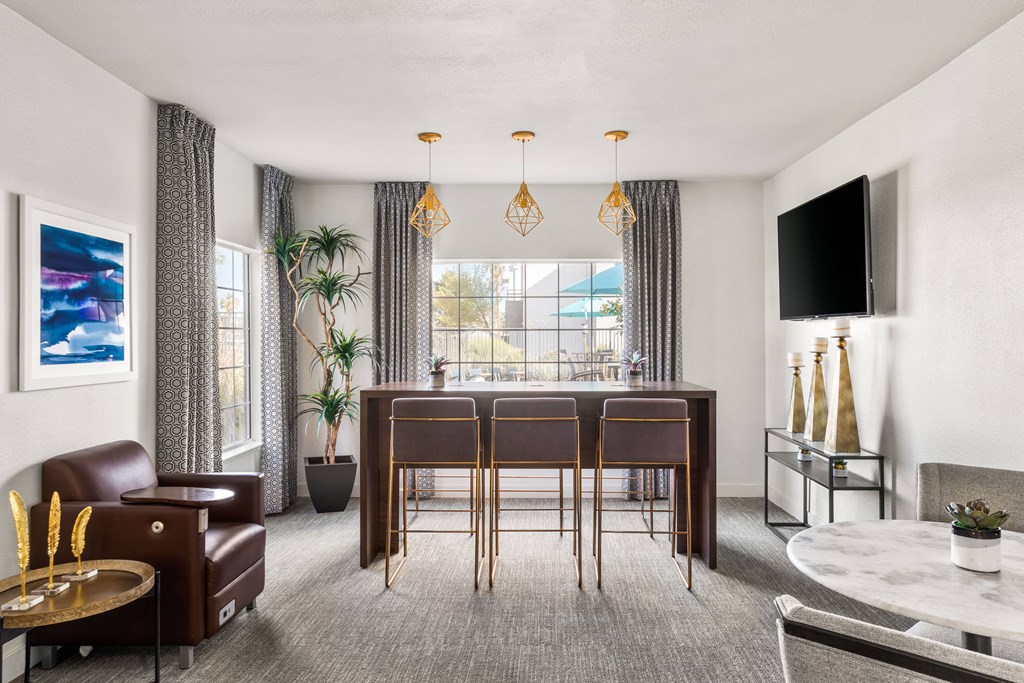 a living room filled with furniture and a large window
